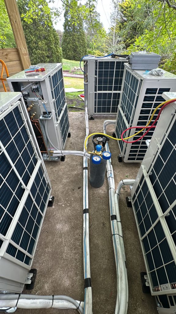 Multiple outdoor air conditioning units during commissioning
